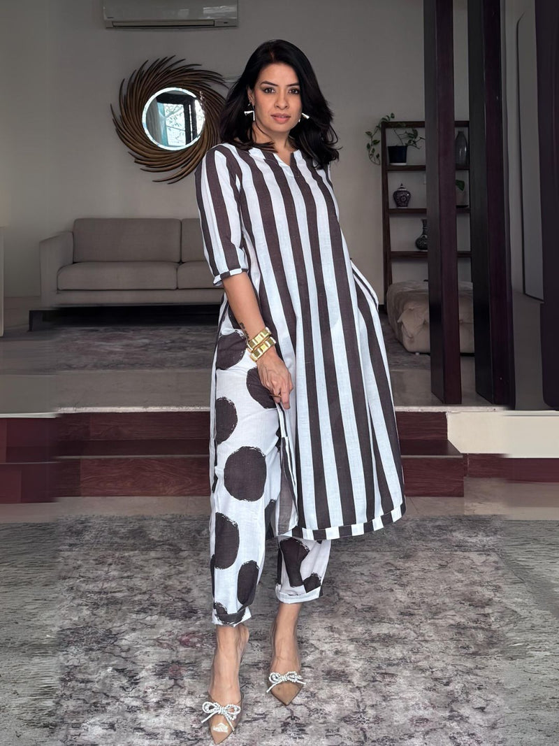 Black and white stripe kurta with functional side plackets paired with pleated polka pants