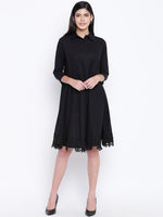 Women's black cotton flowy dress with black lace at bottom hem