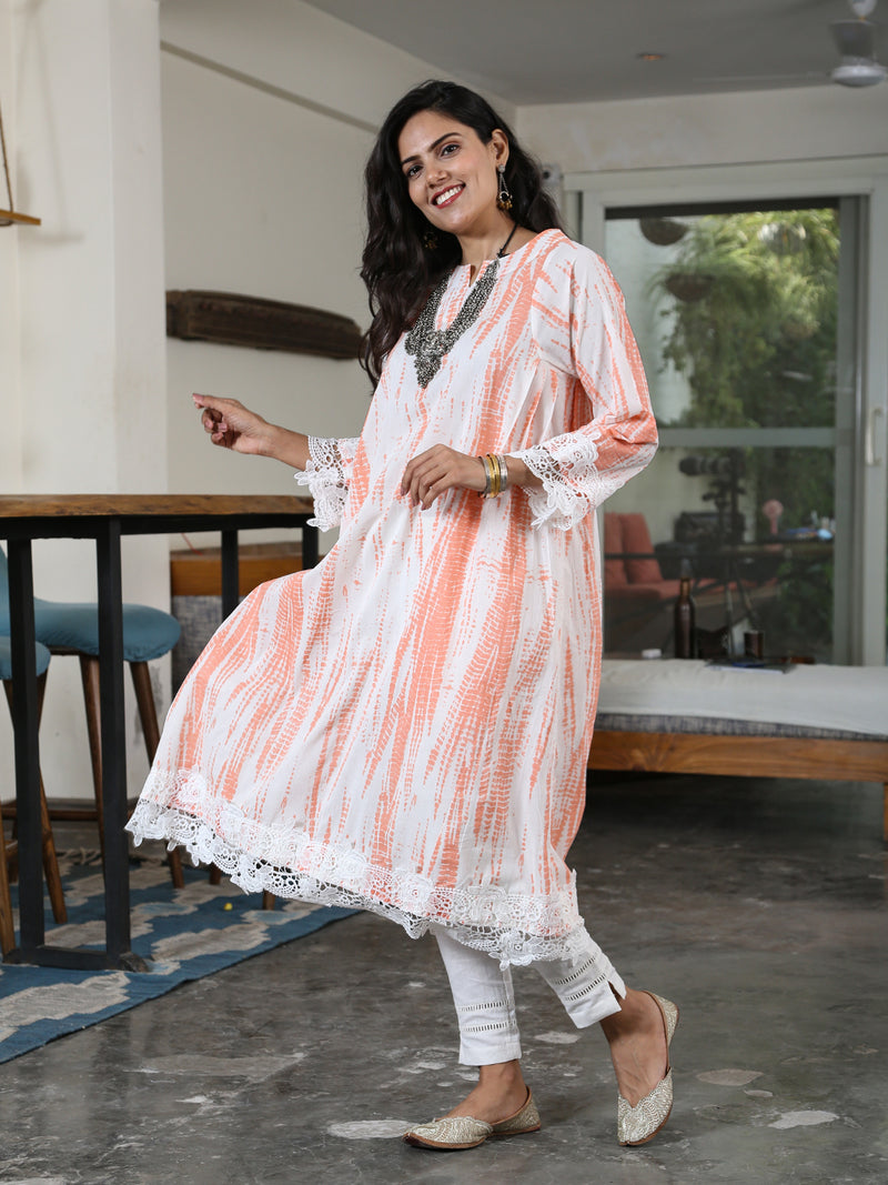 Orange Shibori Print Loose Fit Kurta Only With Pleats On The Sides Detailed With A Broad Lace At The Bottom Hem And Sleeve