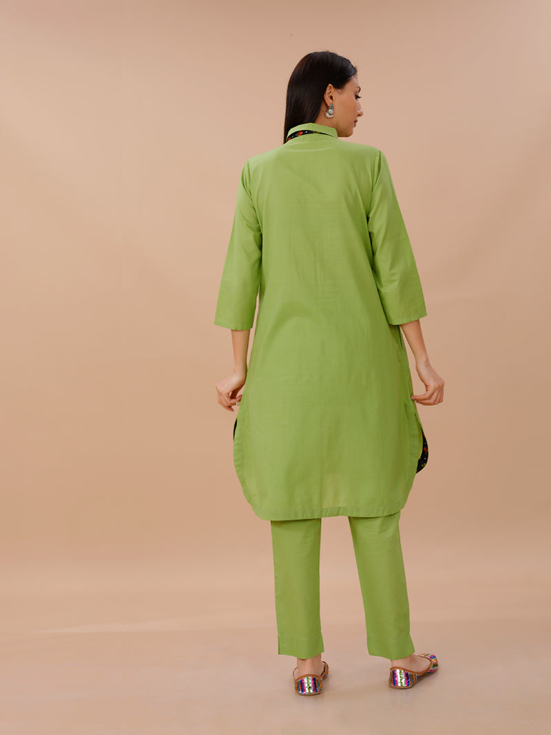 Green Cotton Kurta With Pockets And Blue Printed Fabric Inserts At Neck Band And Bottom Hem Paired With Straight Pants .