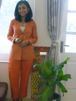 Rust coloured flex straight pants paired with same fabric single buttoned coat with khadi print