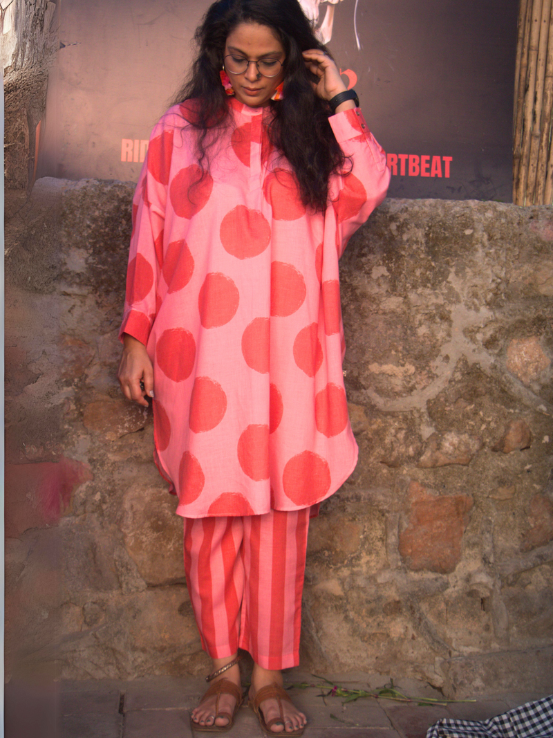 Loose fit kurta in pink and red polka amd stripe combo paired with stripe pants