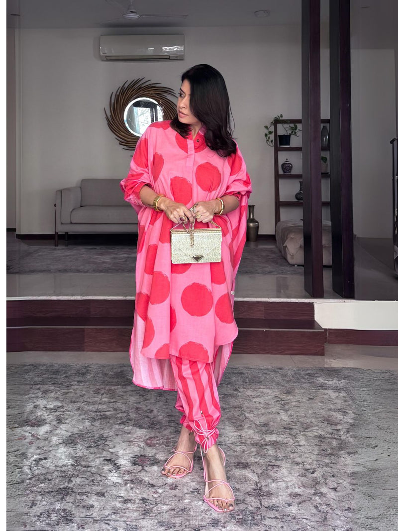 Loose fit kurta in pink and red polka amd stripe combo paired with stripe pants