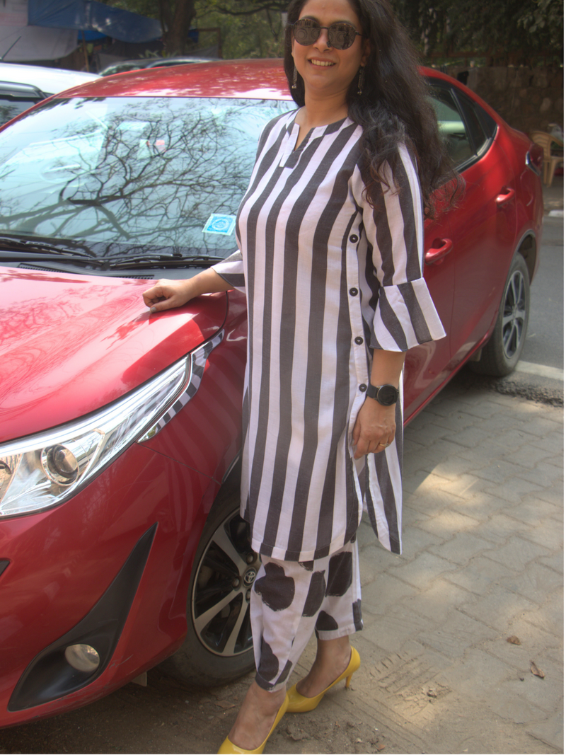 Black and white stripe kurta with functional side plackets paired with pleated polka pants