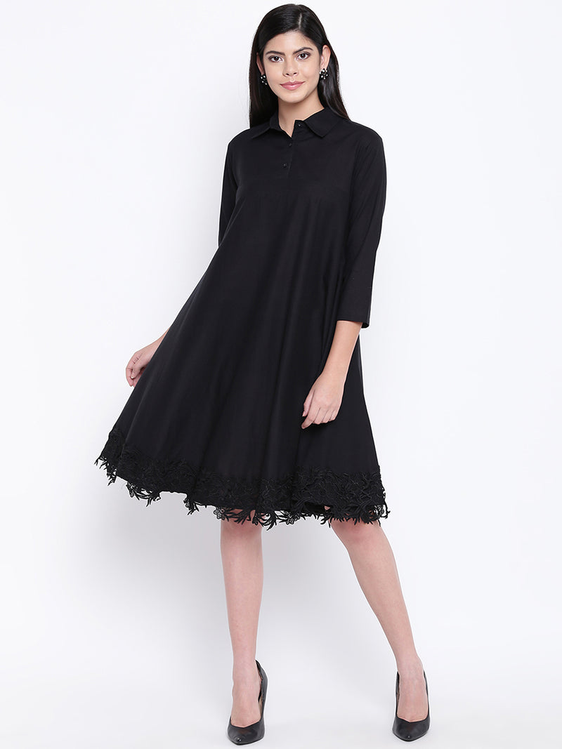 Women's black cotton flowy dress with black lace at bottom hem