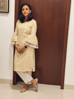 Cotton blend yellow and white stripe straight kurta with flared sleeves embellished with tassles , paired with offwhite cotton pants with curved slits