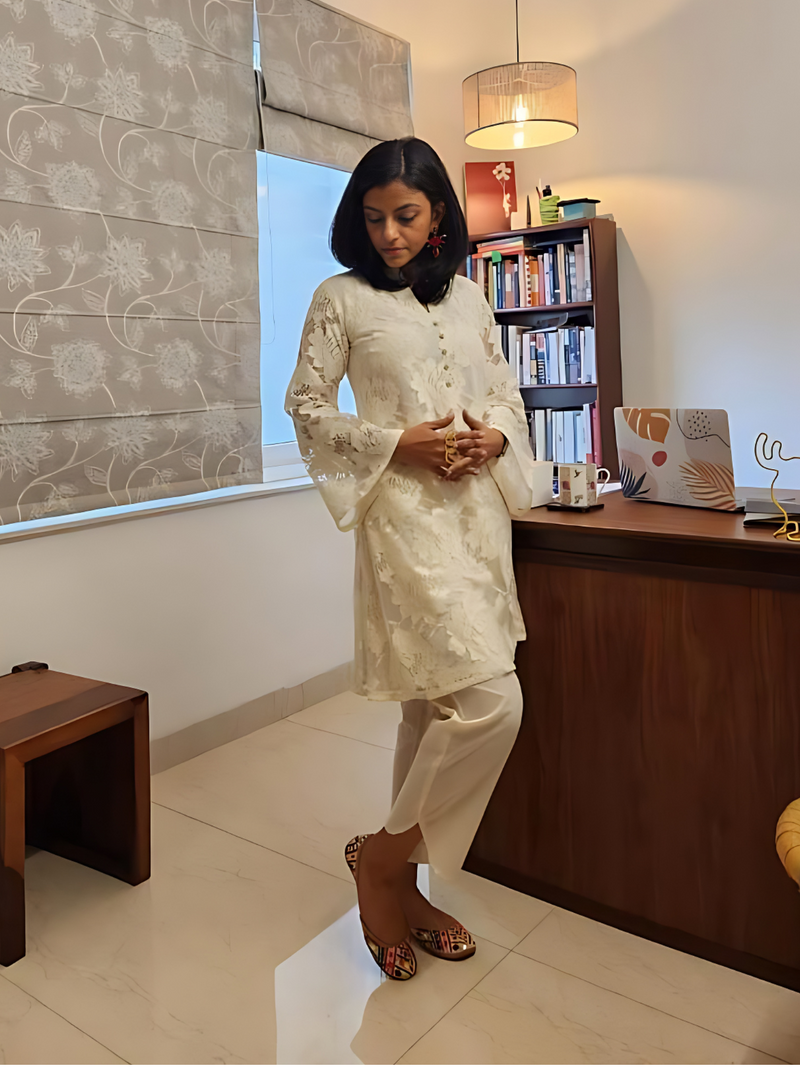 Offwhite lace kurta with bell sleeves , paired with off white cotton pants with curved slits