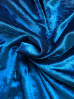 Blue velvet cape with single button closure